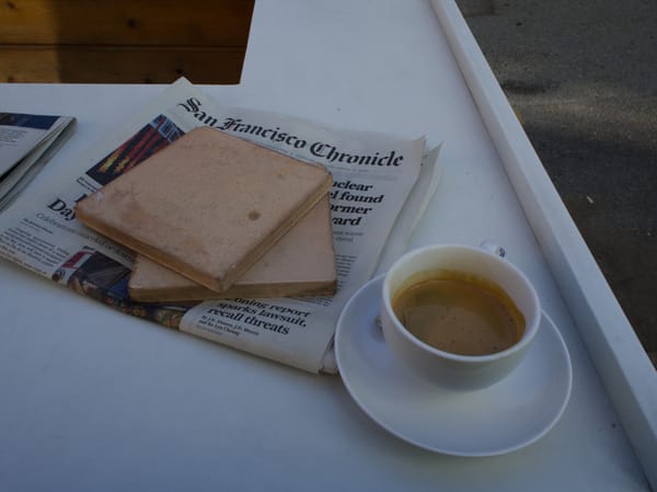 A newspaper and espresso at Coffee Movement